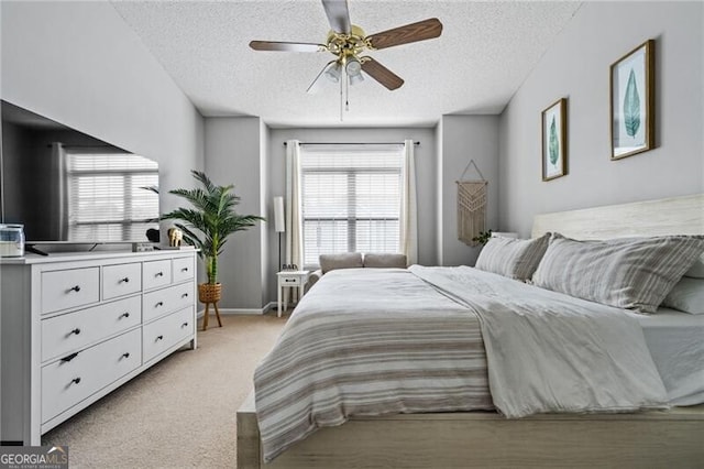 508 Vinings Forest Ct SE, Smyrna, GA 30080 - bedroom with light colored carpet, a textured ceiling, a ceiling fan, and baseboards
