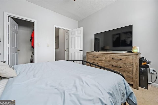 508 Vinings Forest Ct SE, Smyrna, GA 30080 - carpeted bedroom with a spacious closet and a textured ceiling