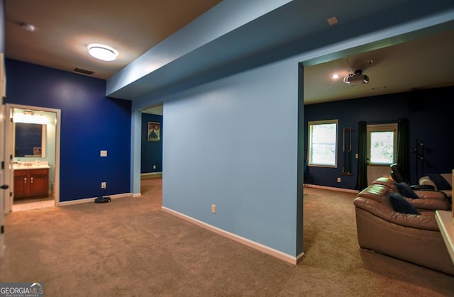 living area with carpet floors and baseboards