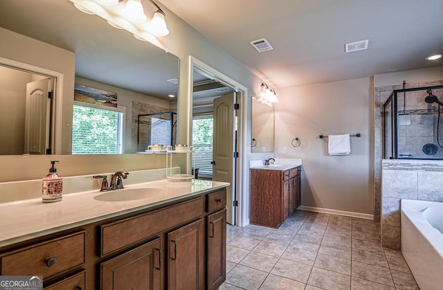 full bath with a shower stall, tile patterned floors, two vanities, and a bath