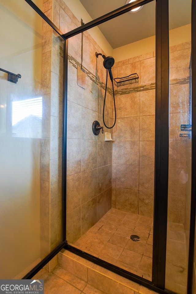 bathroom with a stall shower