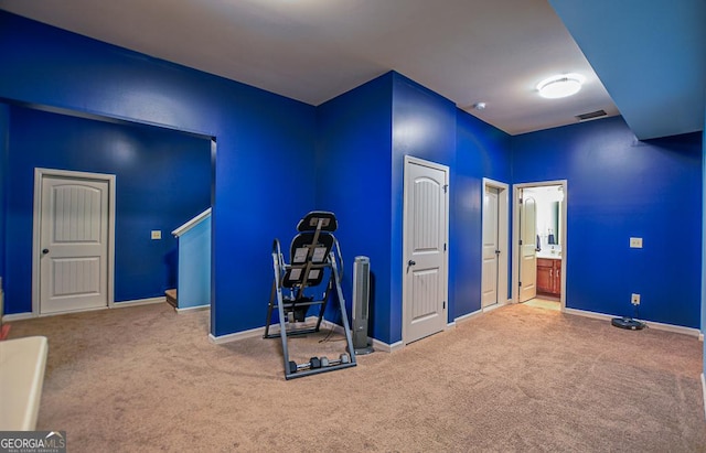 miscellaneous room featuring carpet flooring and baseboards