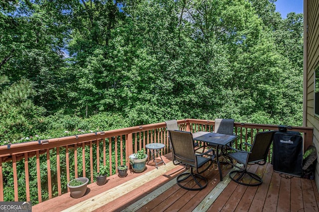 wooden deck with outdoor dining space