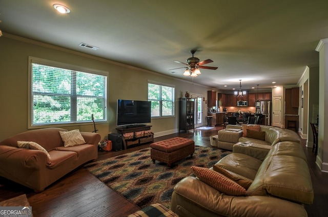 living area featuring dark wood finished floors, ornamental molding, baseboards, ceiling fan, and recessed lighting