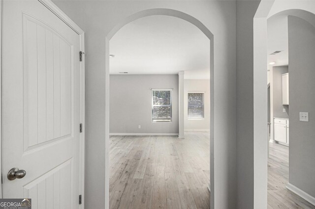 458 Ajo Way, Dallas, GA 30157 - hall featuring arched walkways and light wood finished floors