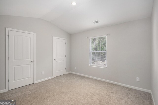 458 Ajo Way, Dallas, GA 30157 - unfurnished bedroom with lofted ceiling and carpet flooring