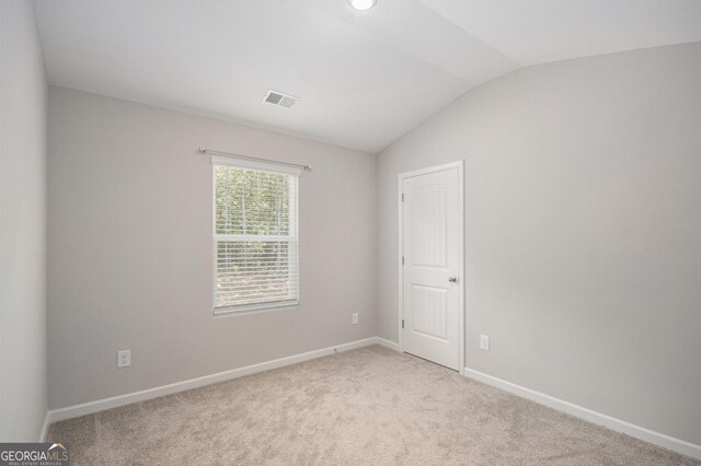458 Ajo Way, Dallas, GA 30157 - unfurnished room with vaulted ceiling and light colored carpet