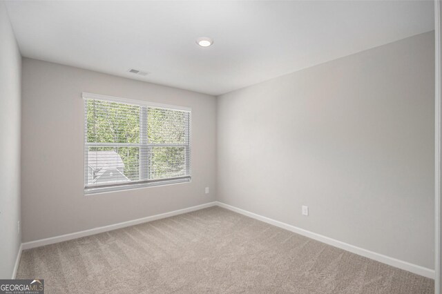 458 Ajo Way, Dallas, GA 30157 - spare room featuring carpet flooring and baseboards