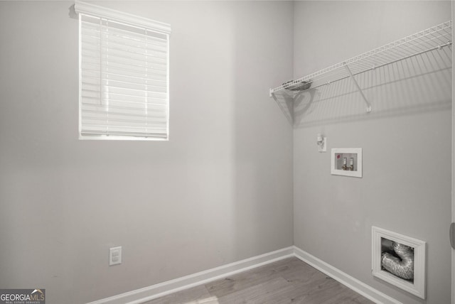 458 Ajo Way, Dallas, GA 30157 - laundry room with hookup for a washing machine, wood finished floors, and electric dryer hookup