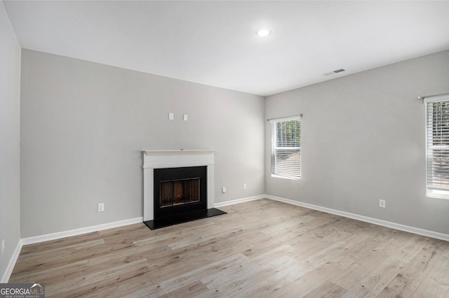 458 Ajo Way, Dallas, GA 30157 - unfurnished living room with wood finished floors, a fireplace, and recessed lighting