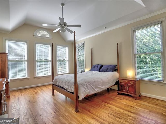 bedroom featuring light wood-style floors, baseboards, vaulted ceiling, and a ceiling fan