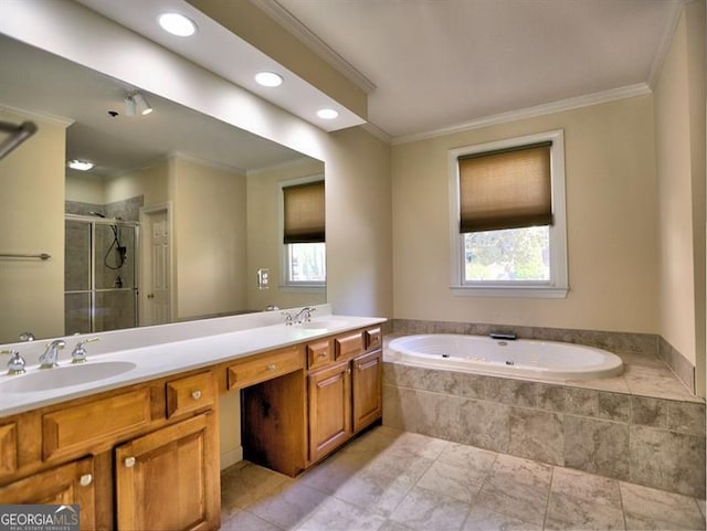 bathroom featuring crown molding, a garden tub, double vanity, a shower stall, and recessed lighting