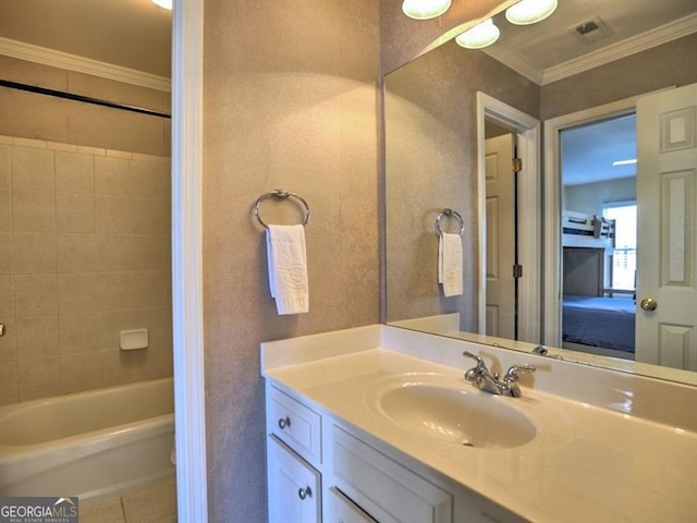full bathroom with ornamental molding, vanity, and tile patterned flooring