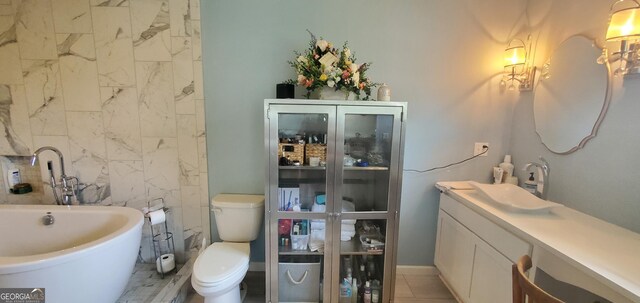 762 Old Mcleod Bridge Rd, Adrian, GA 31002 - full bathroom with toilet, a soaking tub, and vanity