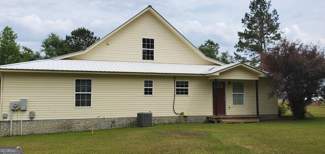 762 Old Mcleod Bridge Rd, Adrian, GA 31002 - back of house with a yard, metal roof, central AC unit, and crawl space