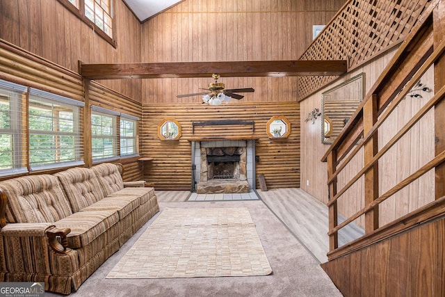 1795 Hutcheson Ferry Rd, Whitesburg, GA 30185 - living area with high vaulted ceiling, a fireplace, ceiling fan, stairs, and log walls