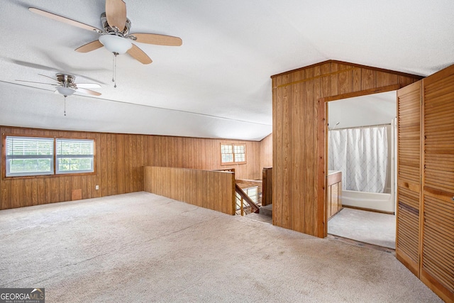 1795 Hutcheson Ferry Rd, Whitesburg, GA 30185 - additional living space with wood walls, carpet, vaulted ceiling, and a ceiling fan