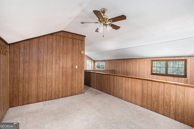 1795 Hutcheson Ferry Rd, Whitesburg, GA 30185 - additional living space with lofted ceiling, wood walls, carpet flooring, healthy amount of natural light, and ceiling fan