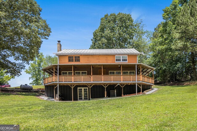 1795 Hutcheson Ferry Rd, Whitesburg, GA 30185 - rear view of property featuring a chimney, french doors, a yard, and a wooden deck