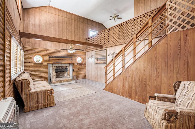 1795 Hutcheson Ferry Rd, Whitesburg, GA 30185 - living room with ceiling fan, a stone fireplace, carpet flooring, rustic walls, and stairs