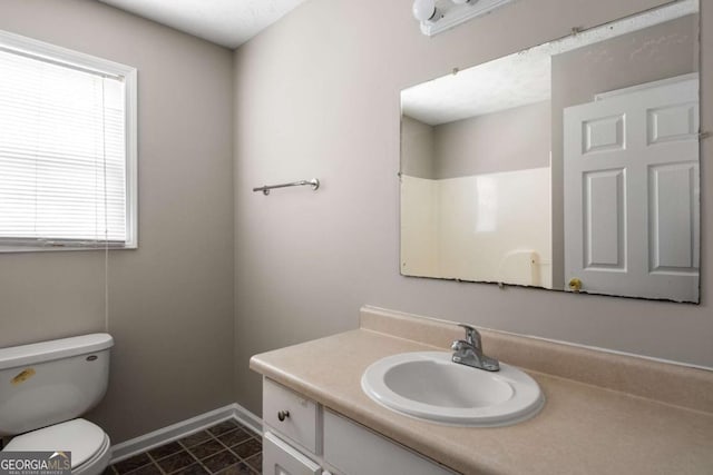 175 Hearth Way, Fairburn, GA 30213 - bathroom with toilet, plenty of natural light, vanity, and baseboards