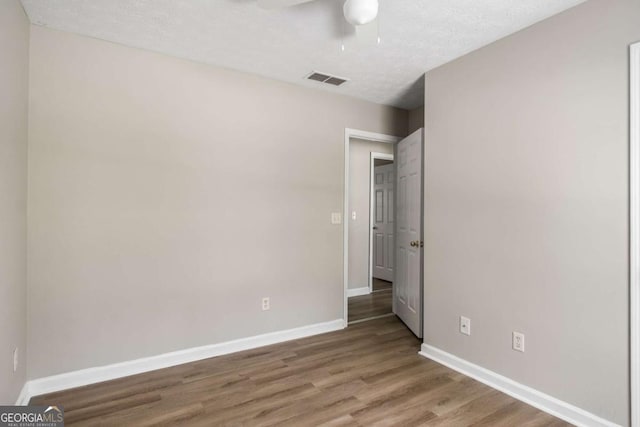 175 Hearth Way, Fairburn, GA 30213 - unfurnished bedroom featuring wood finished floors, baseboards, and ceiling fan