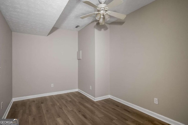 175 Hearth Way, Fairburn, GA 30213 - empty room featuring wood finished floors, a textured ceiling, baseboards, and a ceiling fan