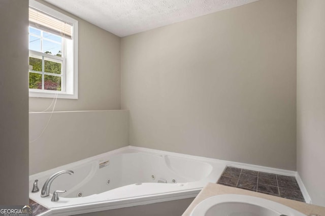 175 Hearth Way, Fairburn, GA 30213 - bathroom with a jetted tub and a textured ceiling