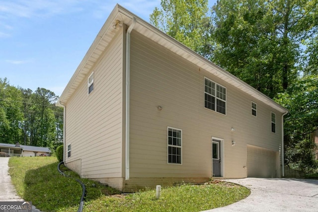 175 Hearth Way, Fairburn, GA 30213 - view of side of property featuring an attached garage and concrete driveway