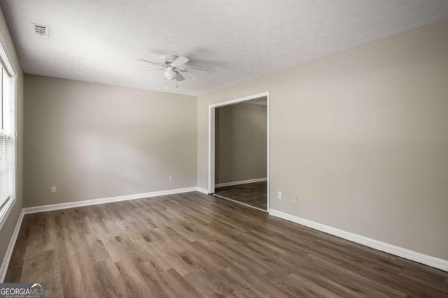 175 Hearth Way, Fairburn, GA 30213 - spare room featuring a ceiling fan, wood finished floors, baseboards, and a textured ceiling