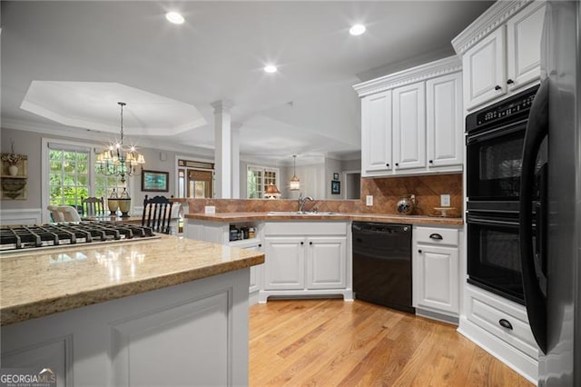 15 Sconti Knoll Dr, Jasper, GA 30143 - kitchen featuring dishwasher, a peninsula, stainless steel gas cooktop, recessed lighting, and light wood-type flooring