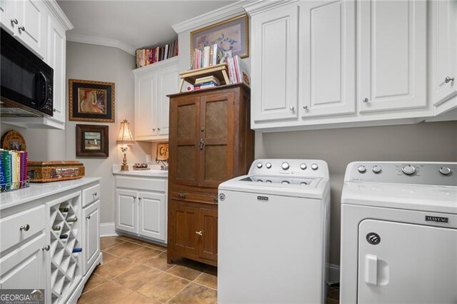 15 Sconti Knoll Dr, Jasper, GA 30143 - laundry area featuring independent washer and dryer, ornamental molding, cabinet space, and light tile patterned flooring