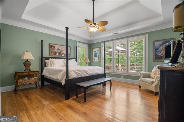 15 Sconti Knoll Dr, Jasper, GA 30143 - bedroom featuring a raised ceiling, light wood-type flooring, baseboards, and crown molding