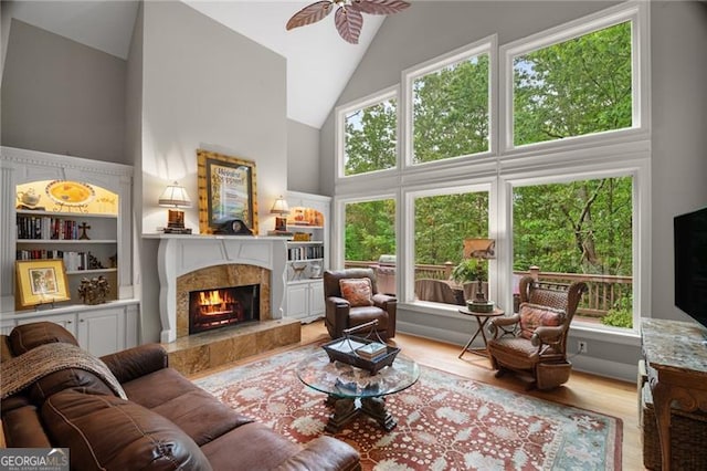 15 Sconti Knoll Dr, Jasper, GA 30143 - living area with a high end fireplace, high vaulted ceiling, wood finished floors, and a ceiling fan