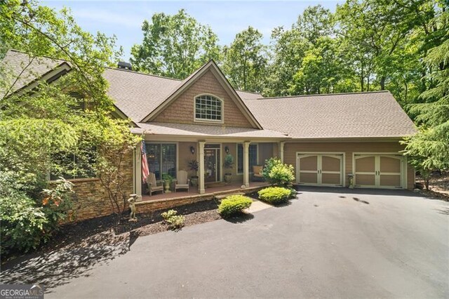 15 Sconti Knoll Dr, Jasper, GA 30143 - craftsman house with an attached garage, asphalt driveway, covered porch, and roof with shingles