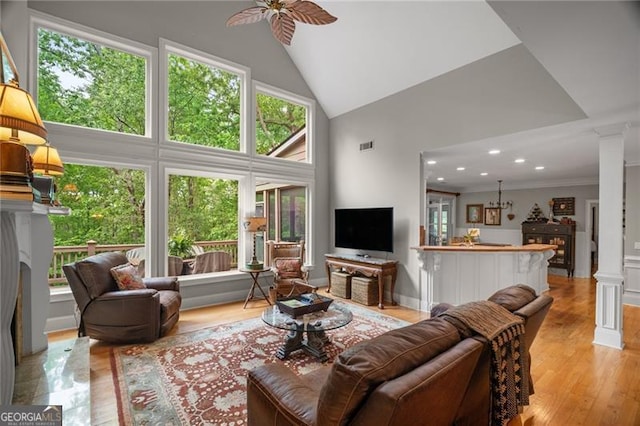 15 Sconti Knoll Dr, Jasper, GA 30143 - living area featuring plenty of natural light, ceiling fan, high vaulted ceiling, light wood-type flooring, and ornate columns