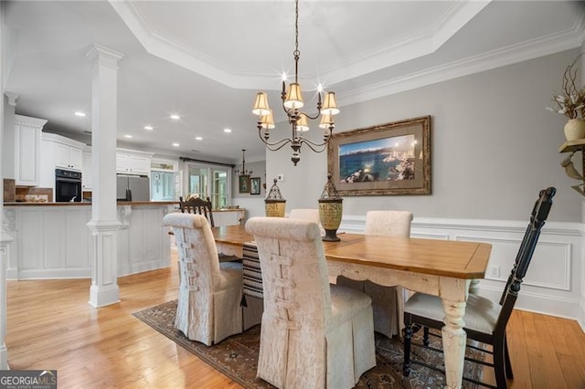 15 Sconti Knoll Dr, Jasper, GA 30143 - dining room with light wood finished floors, crown molding, decorative columns, a chandelier, and a raised ceiling