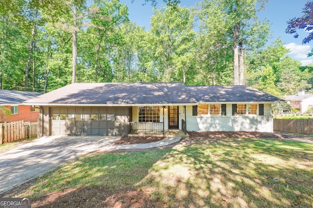 3708 Canadian Way, Tucker, GA 30084 - single story home with fence, concrete driveway, an attached garage, and a porch