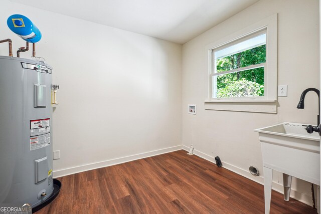 3708 Canadian Way, Tucker, GA 30084 - laundry area featuring electric water heater, washer hookup, dark wood-style flooring, and baseboards