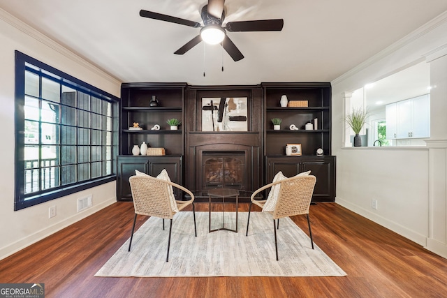 3708 Canadian Way, Tucker, GA 30084 - living area featuring a fireplace, ornamental molding, a ceiling fan, wood finished floors, and baseboards