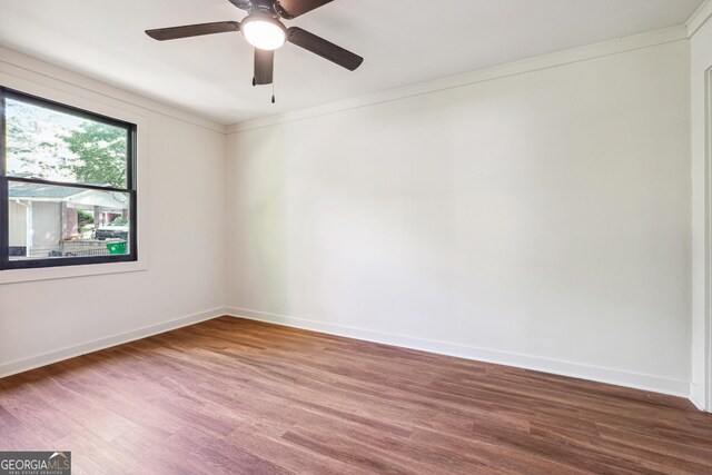 3708 Canadian Way, Tucker, GA 30084 - spare room featuring wood finished floors, baseboards, crown molding, and ceiling fan