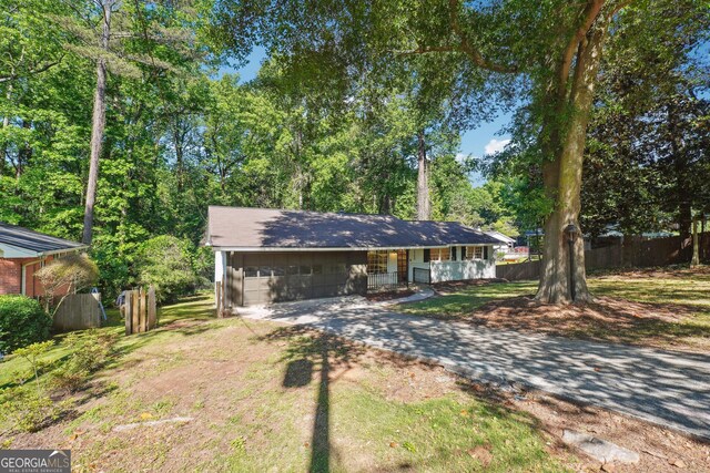 3708 Canadian Way, Tucker, GA 30084 - ranch-style home featuring covered porch and concrete driveway