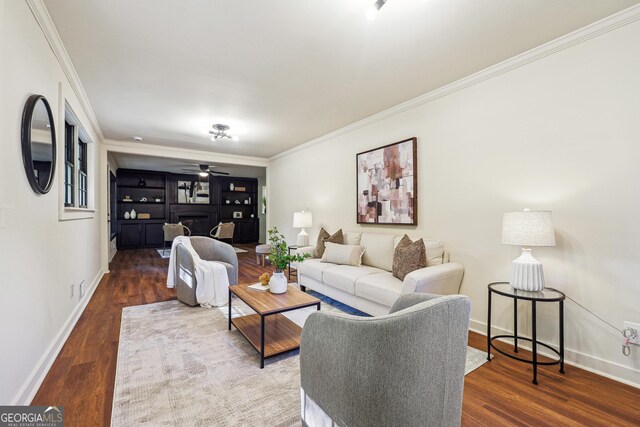 3708 Canadian Way, Tucker, GA 30084 - living room with ornamental molding, wood finished floors, baseboards, and a ceiling fan