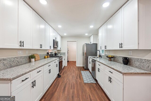 3708 Canadian Way, Tucker, GA 30084 - kitchen featuring stainless steel appliances, dark wood-type flooring, white cabinetry, recessed lighting, and a sink