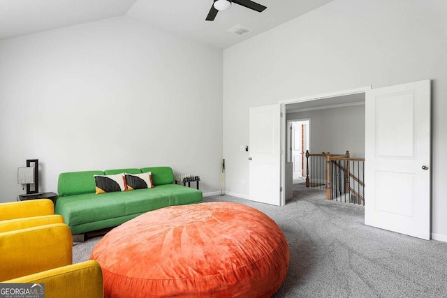 carpeted bedroom featuring lofted ceiling, a ceiling fan, and baseboards