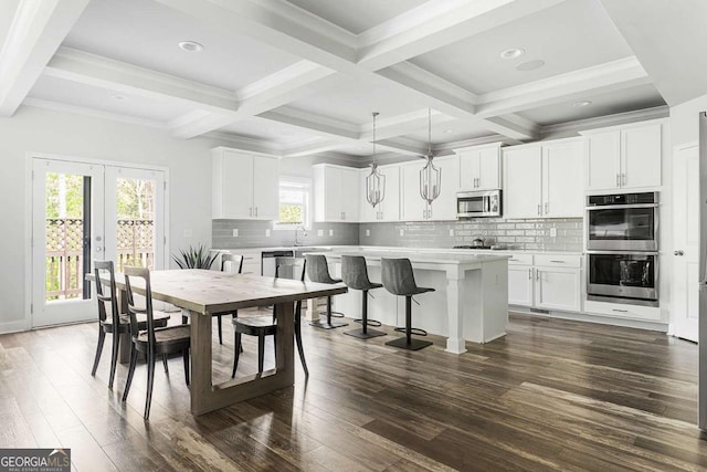 dining space featuring beam ceiling, dark wood-style flooring, coffered ceiling, recessed lighting, and french doors