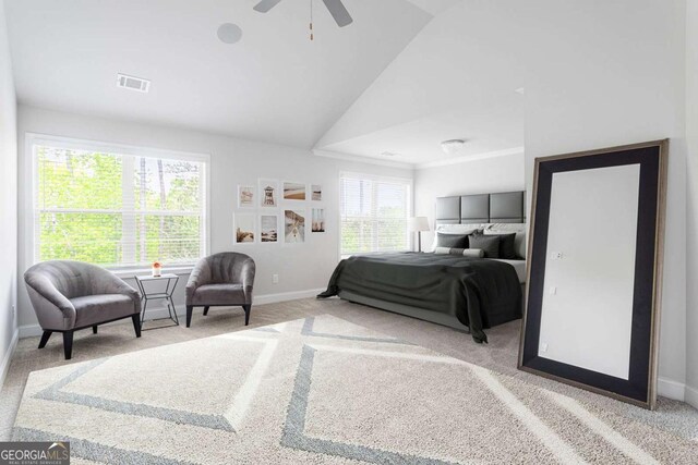 carpeted bedroom featuring baseboards, vaulted ceiling, and ceiling fan
