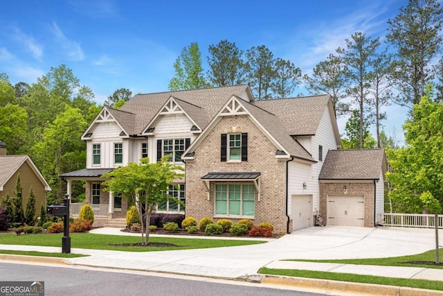 craftsman inspired home featuring driveway, brick siding, a garage, roof with shingles, and fence