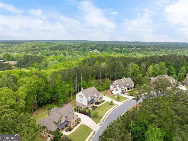 view from above of property with a forest