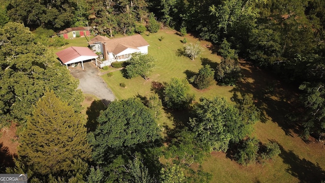 aerial view of property's location with a forest